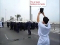 Bahrain Mercenaries shoot the Quran of a Brave Protesters Hands - All Languages