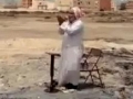 Old Man praying on the ruins of demolished mosque in Bahrain - All Languages